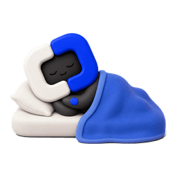 Blue asleep in bed under a blanket.